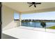 Relaxing balcony featuring a beautiful lake view, modern railings, and neutral colors at 10427 Royal Cypress Way, Orlando, FL 32836