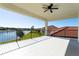 Large balcony featuring lovely views, neutral colors, and a ceiling fan at 10427 Royal Cypress Way, Orlando, FL 32836
