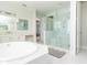 Bright primary bathroom featuring soaking tub and walk-in shower at 10427 Royal Cypress Way, Orlando, FL 32836