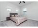 Bedroom with large windows, carpet and ceiling fan at 10427 Royal Cypress Way, Orlando, FL 32836