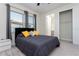 Bedroom with a bed, windows, and closet at 10427 Royal Cypress Way, Orlando, FL 32836