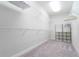 Walk-in closet with carpet and metal shelving at 10427 Royal Cypress Way, Orlando, FL 32836