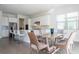 Kitchen and Dining area combination featuring stainless appliances, modern counters, and large table and six chairs at 10427 Royal Cypress Way, Orlando, FL 32836