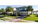 Beautiful two-story home with a well-maintained lawn and a brick driveway leading to an attached two-car garage at 10427 Royal Cypress Way, Orlando, FL 32836