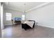 Minimalist living room with hardwood floors, neutral colors, stylish furniture, and ample natural light at 10427 Royal Cypress Way, Orlando, FL 32836