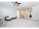 Spacious loft area with neutral walls, carpet flooring, lots of light, and a comfortable seating area at 10427 Royal Cypress Way, Orlando, FL 32836