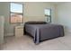 Well-lit main bedroom featuring neutral walls, carpet flooring, side tables, and a king bed at 10427 Royal Cypress Way, Orlando, FL 32836