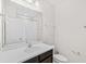 Bright bathroom with a large mirror, single sink vanity, and tub/shower combination at 11686 Water Run Aly, Windermere, FL 34786