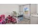 bedroom with bunk beds, play area, and natural light at 11686 Water Run Aly, Windermere, FL 34786