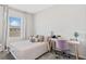 Cozy bedroom features a bright window, desk, and neutral tones at 11686 Water Run Aly, Windermere, FL 34786