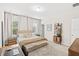 Bedroom featuring carpet, large window with curtains and desk for a relaxed setting at 11686 Water Run Aly, Windermere, FL 34786