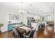 Open concept dining area offers seamless flow to kitchen and living area for easy entertaining at 11686 Water Run Aly, Windermere, FL 34786