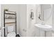 Modern half bath featuring a stylish sink, decorative mirror, and contemporary fixtures, adding convenience at 11686 Water Run Aly, Windermere, FL 34786
