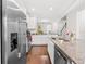 Bright kitchen boasts stainless steel appliances, granite countertops, and an open layout with backyard views at 11686 Water Run Aly, Windermere, FL 34786