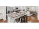 Modern kitchen features granite countertops, stainless steel appliances, and a convenient breakfast bar with seating at 11686 Water Run Aly, Windermere, FL 34786