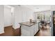 Stylish kitchen island features granite countertops, stainless steel appliances, and an undermount sink at 11686 Water Run Aly, Windermere, FL 34786