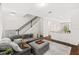 Spacious living room with an open floor plan, modern decor, and ample natural light, enhancing the home's appeal at 11686 Water Run Aly, Windermere, FL 34786