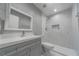 Updated bathroom featuring a walk-in shower with new fixtures and vanity at 1184 Calanda Ave, Orlando, FL 32807