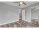 Bedroom featuring wood-look floors, ceiling fan, and closet at 1184 Calanda Ave, Orlando, FL 32807