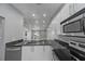 Modern kitchen featuring stainless steel appliances, granite countertops, and lots of lighting at 1184 Calanda Ave, Orlando, FL 32807