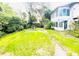 Lush backyard with mature trees and green grass at 1403 N Fern Creek Ave, Orlando, FL 32803