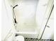 Bathroom features a shower over bath with tiling and a window at 1403 N Fern Creek Ave, Orlando, FL 32803