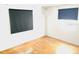 Bedroom with hardwood floors, neutral walls, and window coverings at 1403 N Fern Creek Ave, Orlando, FL 32803