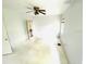 Bright bedroom featuring ceiling fan, neutral walls and a view to a hallway at 1403 N Fern Creek Ave, Orlando, FL 32803