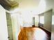 Spacious bedroom with hardwood floors, closet and window, offering a bright, airy feel at 1403 N Fern Creek Ave, Orlando, FL 32803