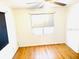 Bedroom with hardwood floors, neutral walls, and window coverings at 1403 N Fern Creek Ave, Orlando, FL 32803