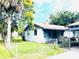 Home exterior showcasing a quaint yard and carport at 1403 N Fern Creek Ave, Orlando, FL 32803