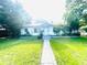 Charming single-story home with a well-manicured lawn at 1403 N Fern Creek Ave, Orlando, FL 32803