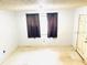 Cozy living room featuring black curtains and a front door at 1403 N Fern Creek Ave, Orlando, FL 32803