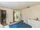 Bright bedroom featuring neutral walls, open closet, and doorway to another room at 1421 Summit Hill Dr, Deltona, FL 32725