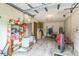 Spacious garage featuring concrete block walls and ample storage space at 1421 Summit Hill Dr, Deltona, FL 32725