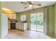 Bright kitchen features a combination of white cabinets and countertops with direct access to the backyard at 1421 Summit Hill Dr, Deltona, FL 32725
