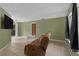 Open concept living area with easy access to the backyard featuring neutral tile flooring throughout the home at 1421 Summit Hill Dr, Deltona, FL 32725
