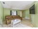 Comfortable living room featuring tile flooring, a sofa, and a mounted TV for entertainment at 1421 Summit Hill Dr, Deltona, FL 32725