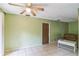 Inviting living area with tile flooring, ceiling fan, and a neutral color palette at 1421 Summit Hill Dr, Deltona, FL 32725