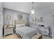 Cozy bedroom with neutral tones, a comfortable bed, and decorative accents for a serene retreat at 14213 Southern Red Maple Dr, Orlando, FL 32828