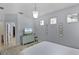 Calm bedroom with a comfortable bed, large windows, and stylish decor at 14213 Southern Red Maple Dr, Orlando, FL 32828