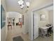 A light-filled hallway with arched doorways, tile flooring, and views into the living room and other living areas at 14213 Southern Red Maple Dr, Orlando, FL 32828