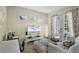 Comfortable living area with a TV, light, and access to the outdoors, perfect for relaxing at 14213 Southern Red Maple Dr, Orlando, FL 32828