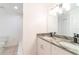 Bathroom featuring double vanity with stone countertop and modern lighting at 1530 Monica St, Deltona, FL 32725