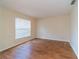A bedroom with wood floors, natural light, and ample closet space at 1530 Monica St, Deltona, FL 32725