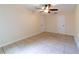 Comfortable bedroom with tile flooring and two closets for ample storage at 1530 Monica St, Deltona, FL 32725