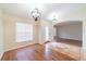 Elegant dining area with stylish chandelier and beautiful tile flooring at 1530 Monica St, Deltona, FL 32725