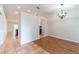Cozy dining room with modern lighting and a mix of tile and wood flooring at 1530 Monica St, Deltona, FL 32725