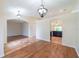 Inviting living area featuring an open layout with a mix of tile and wood flooring at 1530 Monica St, Deltona, FL 32725