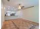 Spacious living area with tile flooring, open to the kitchen and dining at 1530 Monica St, Deltona, FL 32725